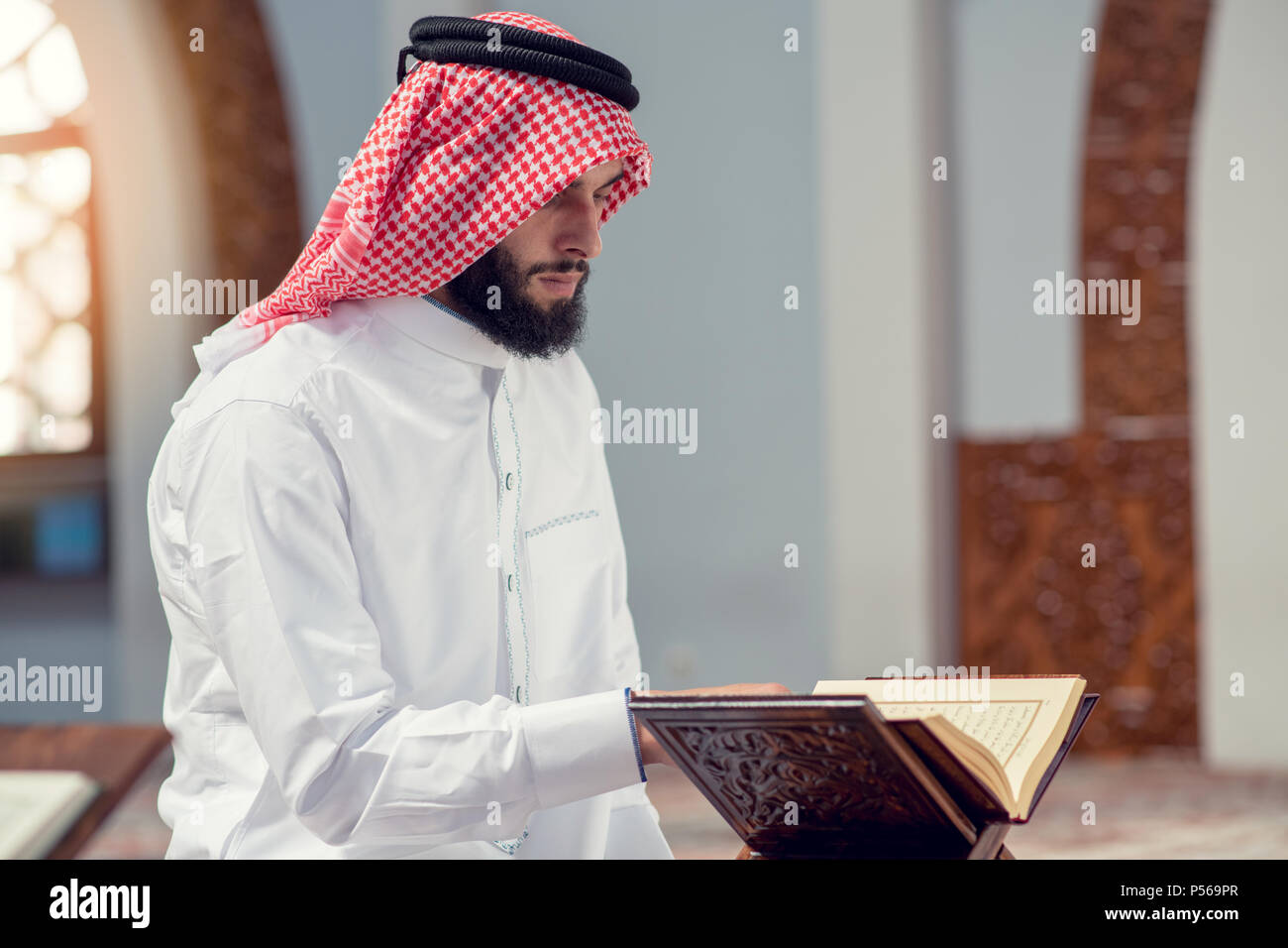 Religious muslim man praying inside the mosque Stock Photo
