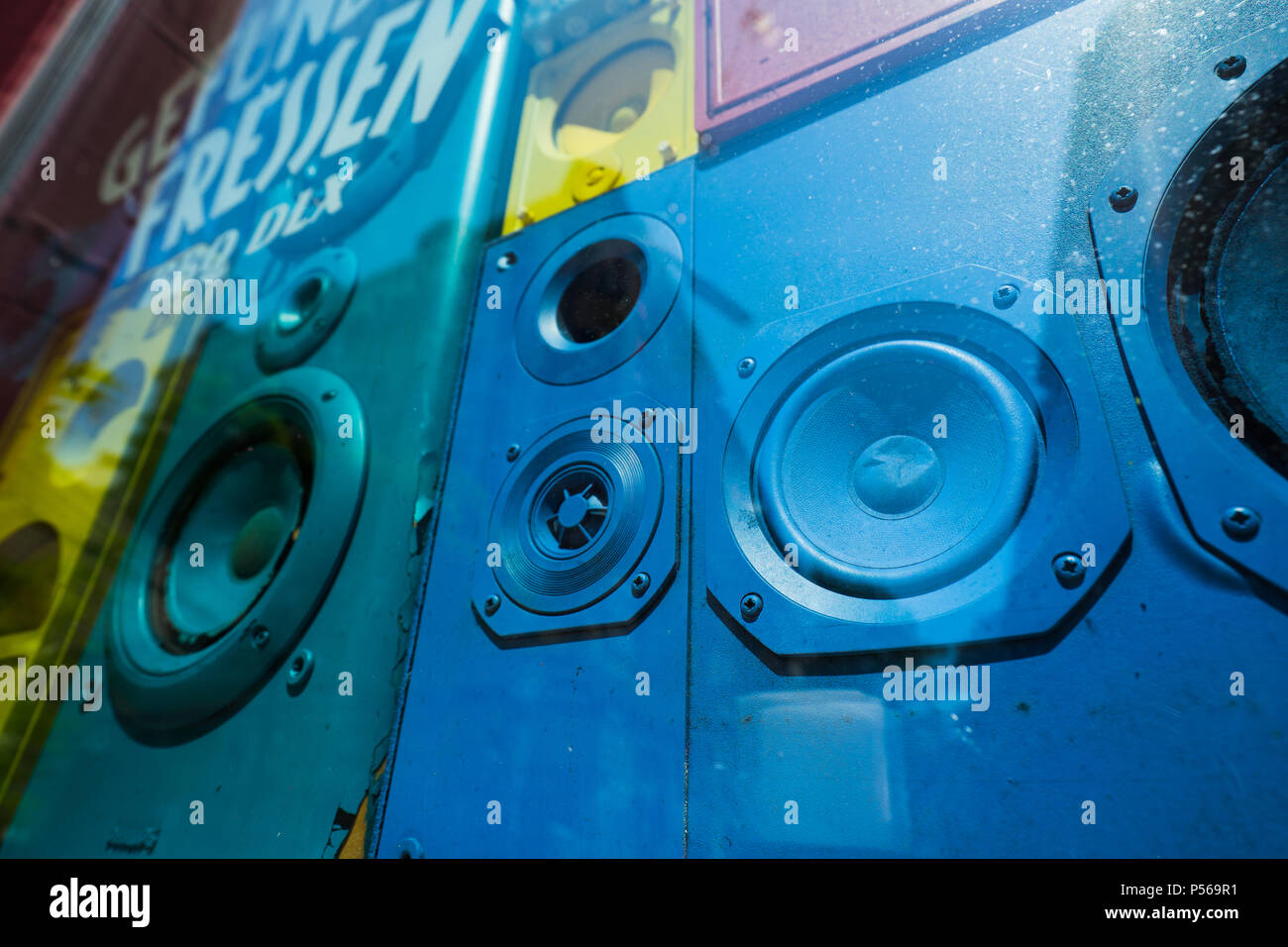 Old colorful sound speakers boxes in shop window vitrine. Concept of retro vintage interior decoration Stock Photo