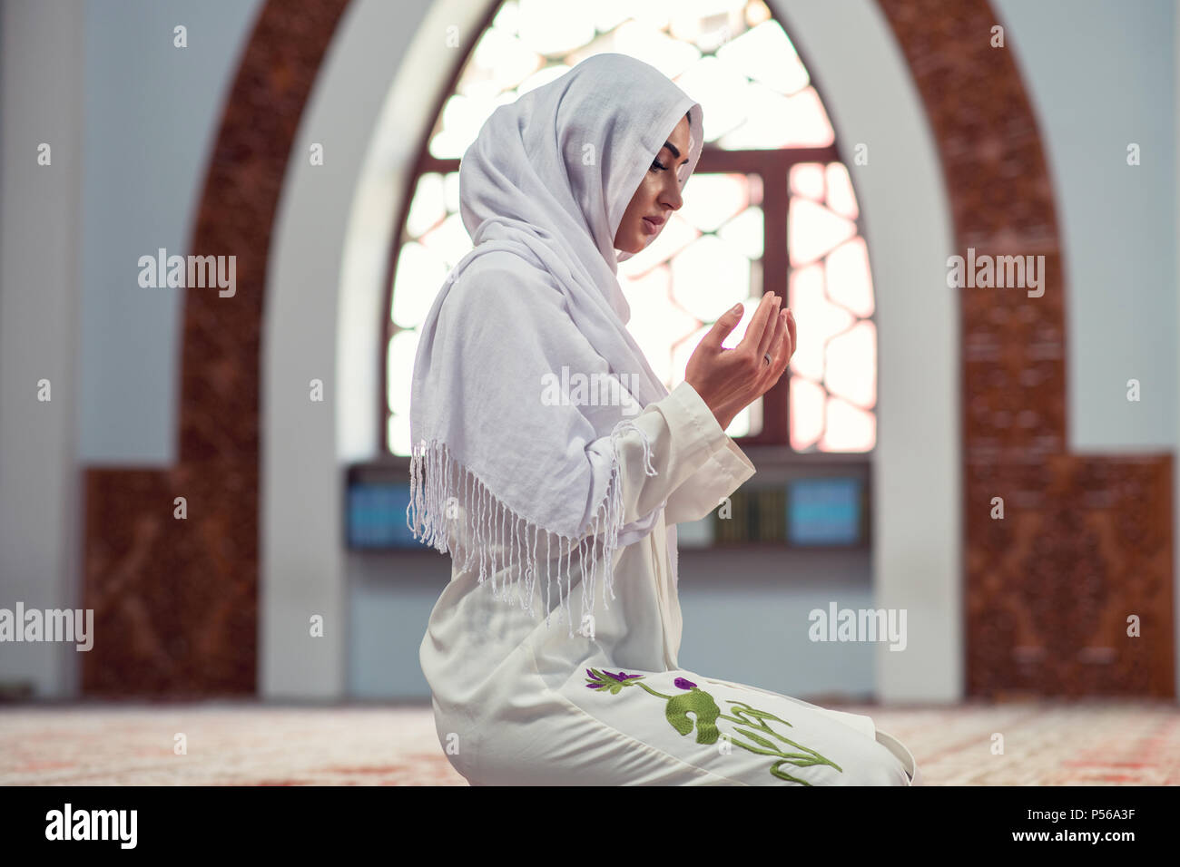 Arabic Young muslim woman praying in mosque Stock Photo Alamy
