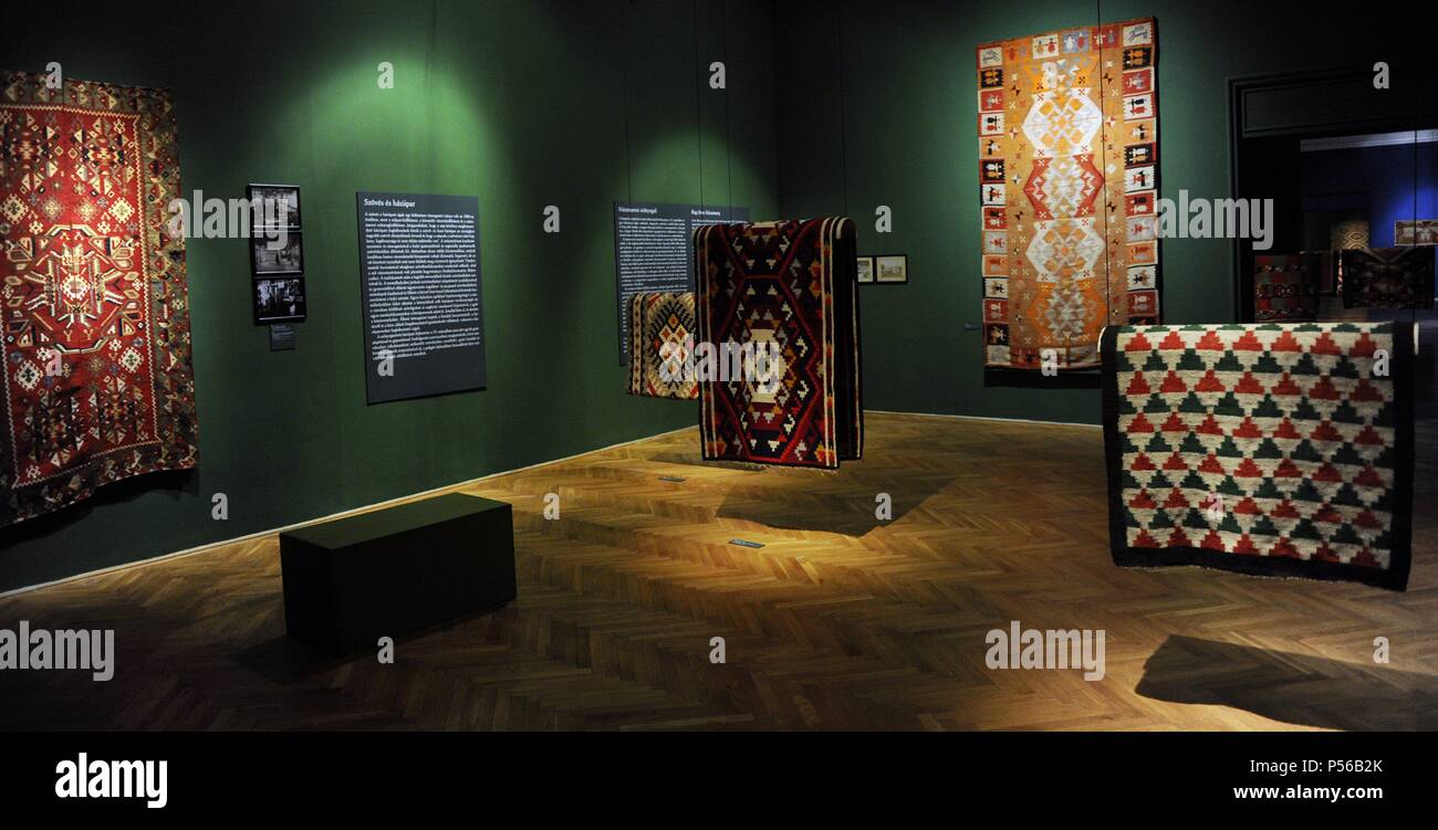 Rugs in a room dedicated to working women and the beginning of the industry. Interior. Ethnographic Museum. Budapest. Hungary. Stock Photo