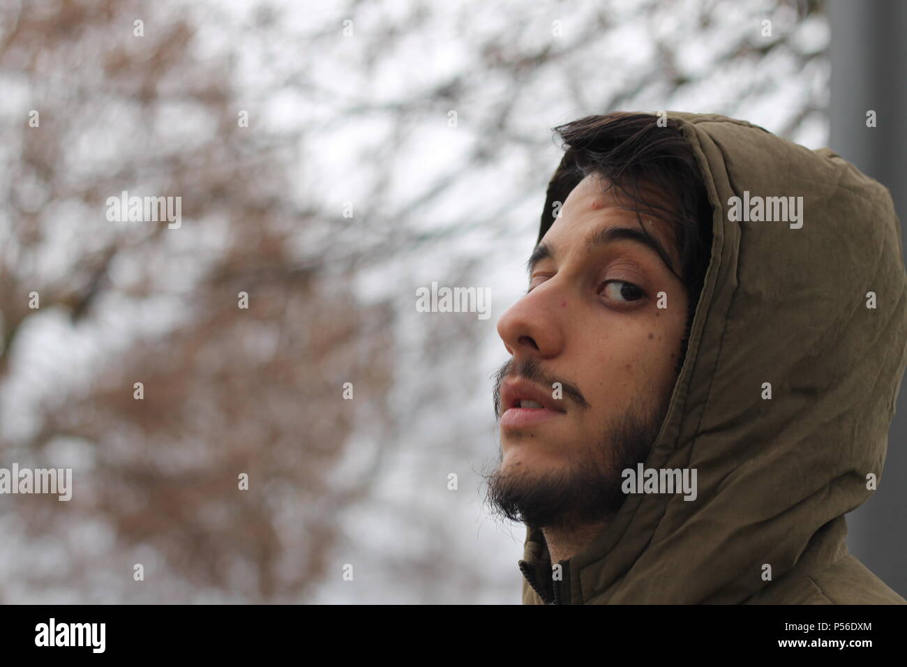 Young men thinking with his hand on chin. Looking upset or sad. Stock Photo