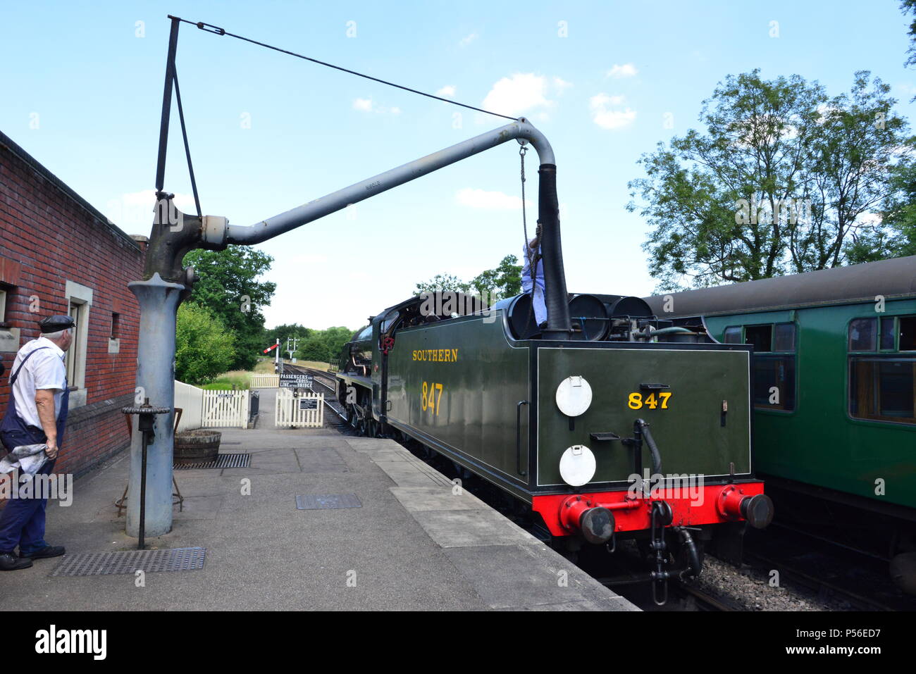 Steam Train Filling Water Stock Photos & Steam Train Filling Water