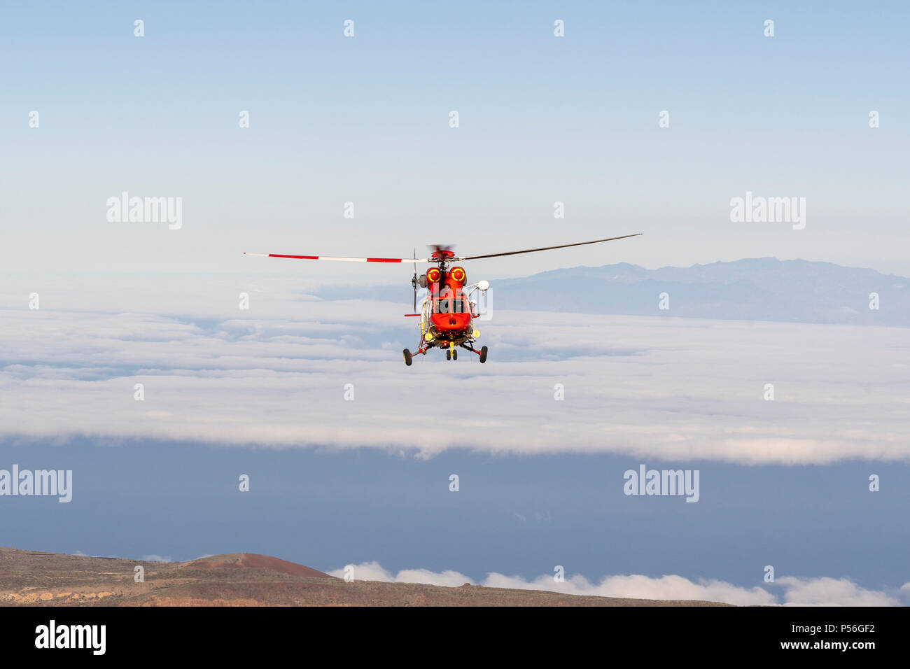 Mountain Rescue Helicopter is called by Altavista Refuge staff to intervene and pick up an elderly man who suffers from altitude sickness above 3000m Stock Photo