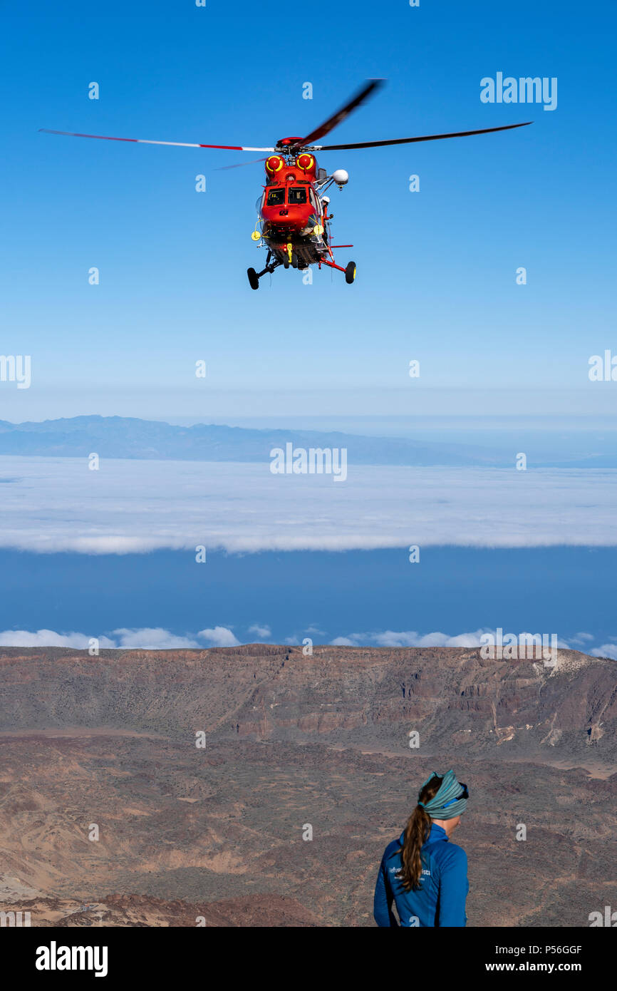 Mountain Rescue Helicopter is called by Altavista Refuge staff to intervene and pick up an elderly man who suffers from altitude sickness above 3000m Stock Photo