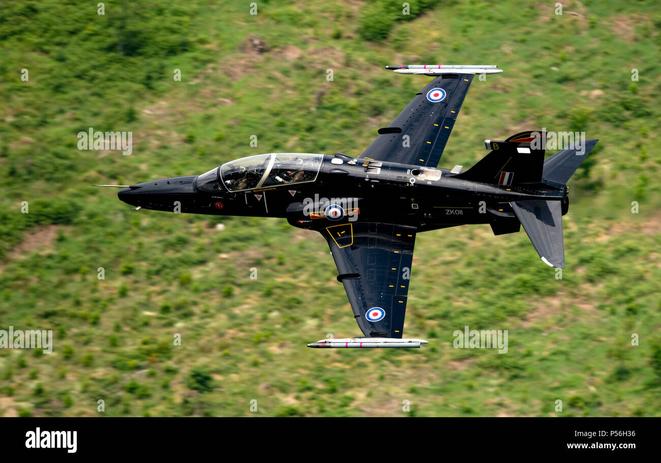 RAF Hawk T2 Jet Trainer flying low level in the mach loop area of Wales (LFA7, low flying area 7) near Snowdonia Stock Photo