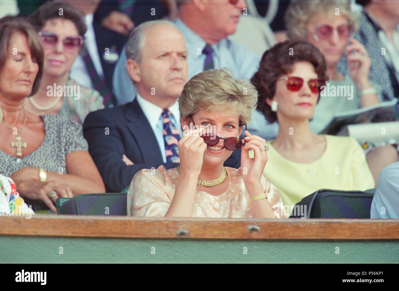 HRH The Princess of Wales, Princess Diana, attends the 1993 Men's Singles Wimbledon Tennis Final. She wears or attends to her sunglasses for most of the pictures on this sunny day as it was. The Princess is shown sitting next to her mother Frances Shand Kydd. Regarding the match, Pete Sampras defeated Jim Courier 7¿(7¿), 7¿(8¿), 3¿, 6¿in the final to win the Gentlemen's Singles title at the 1993 Wimbledon Championships. This was the first of Pete's Open Era record of seven Wimbledon titles.  Picture taken 4th July 1993 Stock Photo