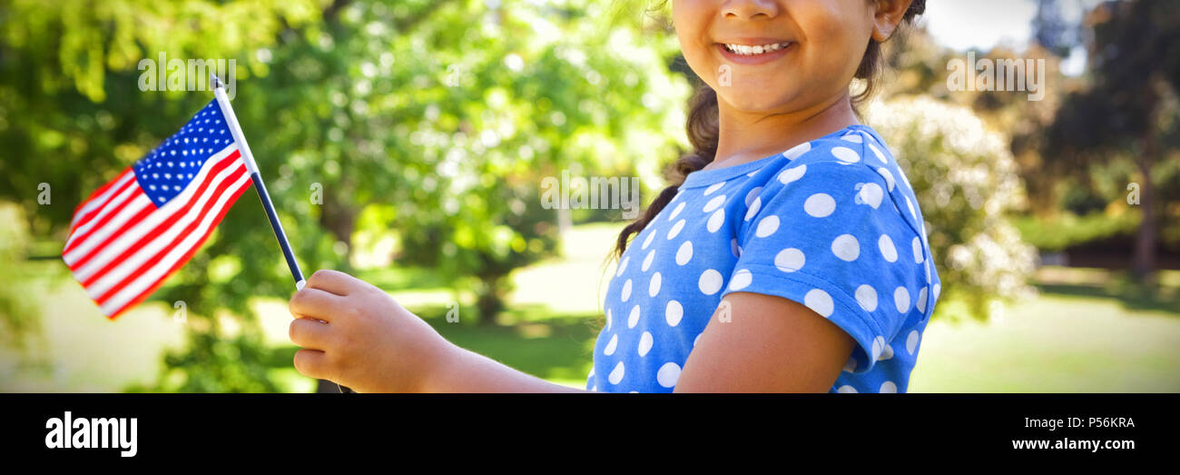 Girl holding American flag Stock Photo - Alamy