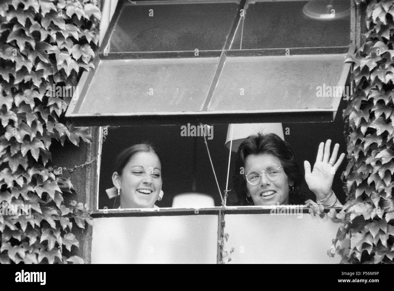 Wimbledon Tennis Championships, Friday 6th July 1973.  Our picture shows ... smiles hide the frustration of Chris Evert (left) and Billie Jean King, kept off court, Women Singles Final, by the rain at Wimbledon. Stock Photo