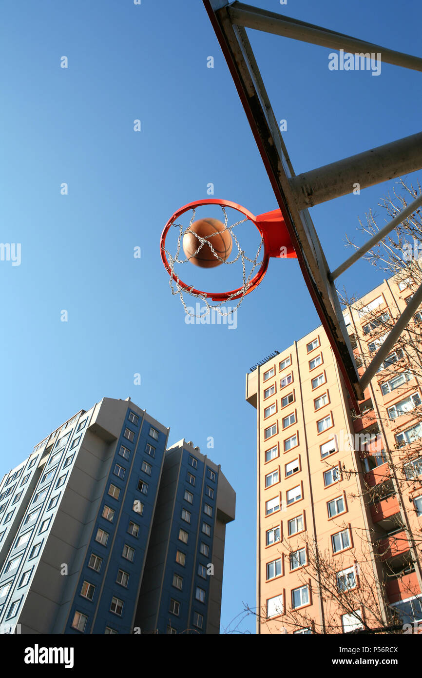 an image of basketball pot, ball and buildings Stock Photo