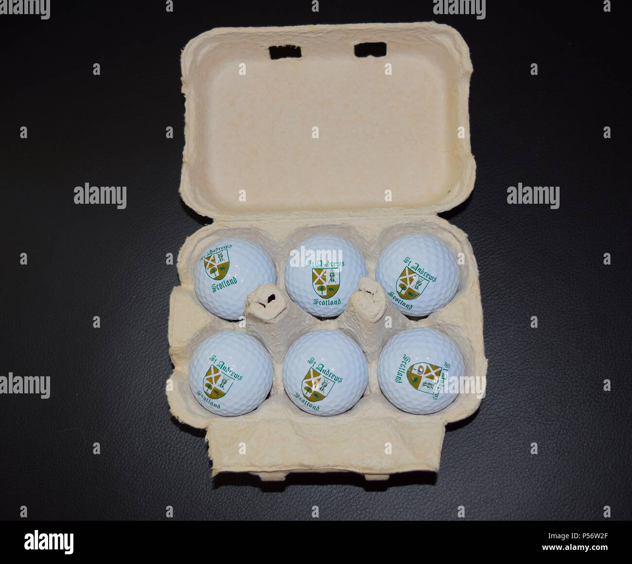 Golf balls in the egg container, funny quirky image Stock Photo Alamy