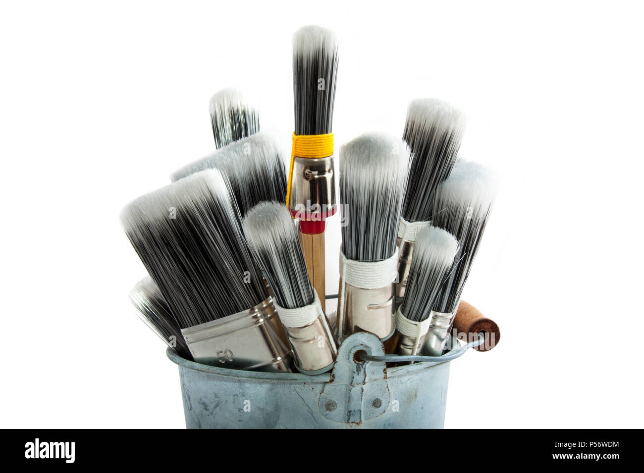 Paint brushes in bucket for background use Stock Photo - Alamy