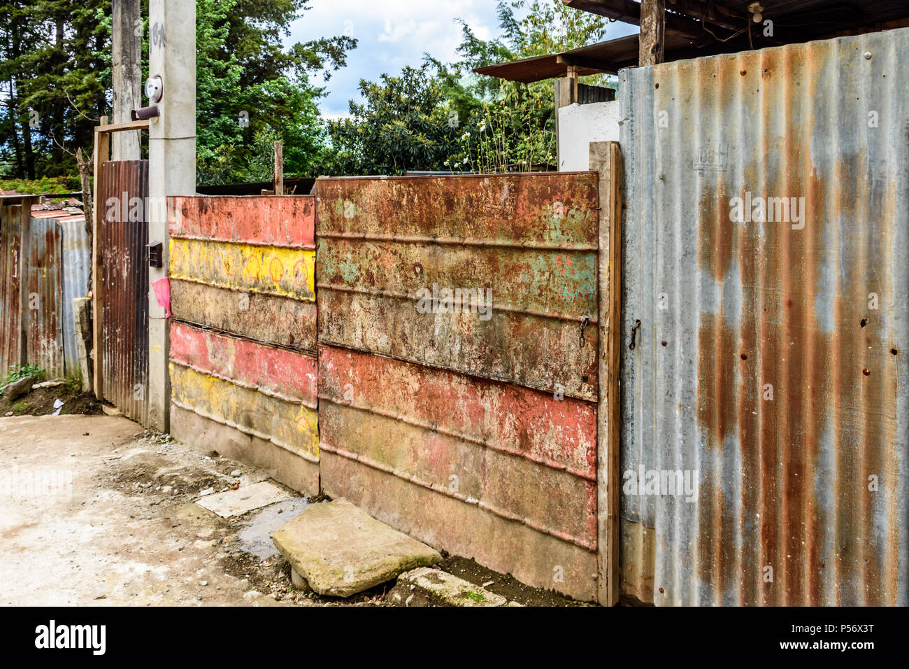 San Juan del Obispo, Guatemala - June 25, 2017: Corrugated iron fence in village near colonial town & UNESCO World Heritage Site of Antigua Stock Photo