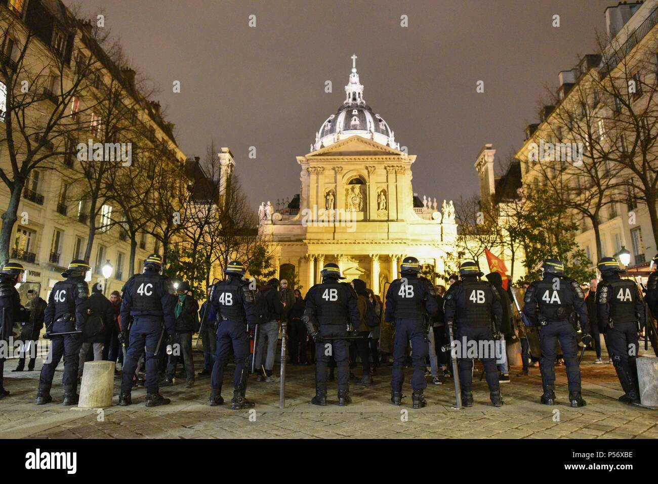 March 23, 2018 - Paris, France: French riot police block the access to the University of Sorbonne after scores of students rallied there to protest against the violent evacuation of students occupying an amphitheater at the University of Montpellier in southern France. Hundreds of riot police were deployed in the neighborhood as authorities worry about actions that would echo the May 68 student protests. Des CRS interviennent place de la Sorbonne pour disperser une manifestation etudiante. Les mois de mars et d'avril 2018 ont ete marques par une recrudescence de manifestations etudiantes et de Stock Photo