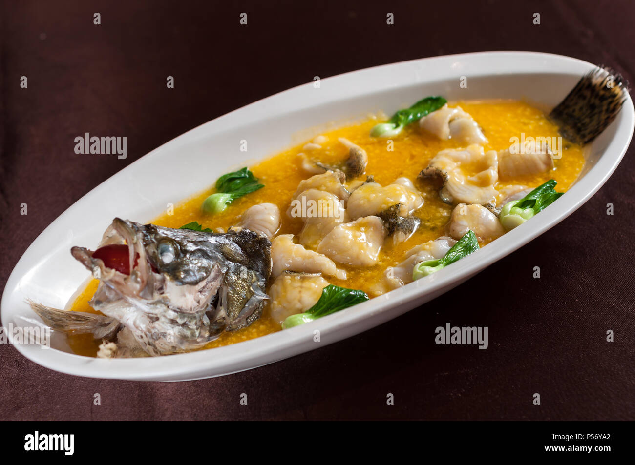 braised mandarin fish with millet Stock Photo Alamy