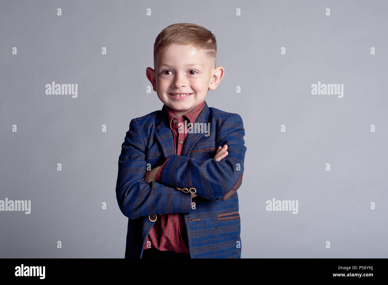 portrait of cute little boy in jacket happy smiling indoors Stock Photo ...