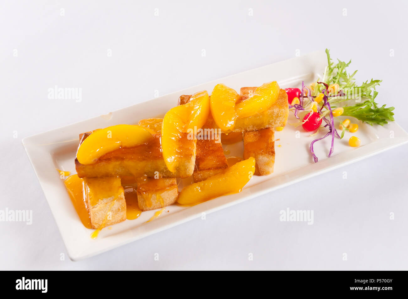 Yellow peach palm sugar thick toast Stock Photo