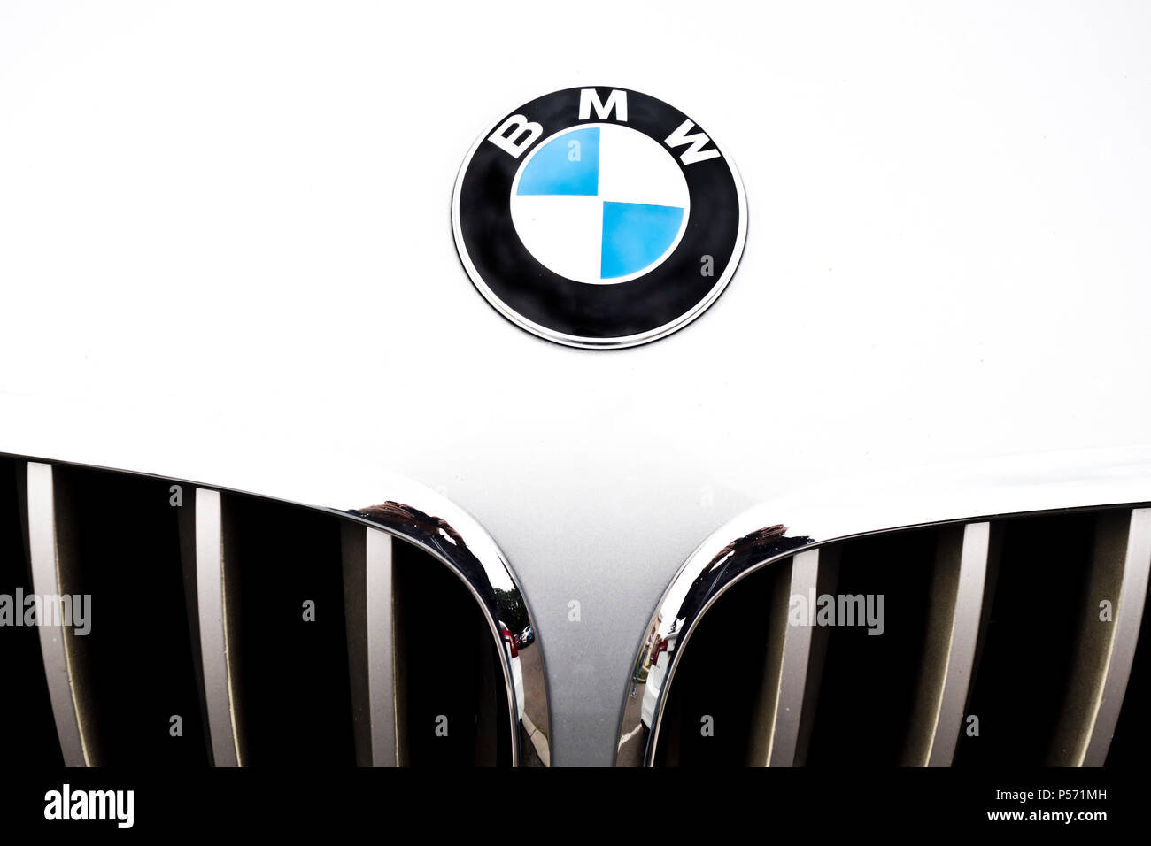 close up detail of a white BMW car hood and grille with logo Stock Photo