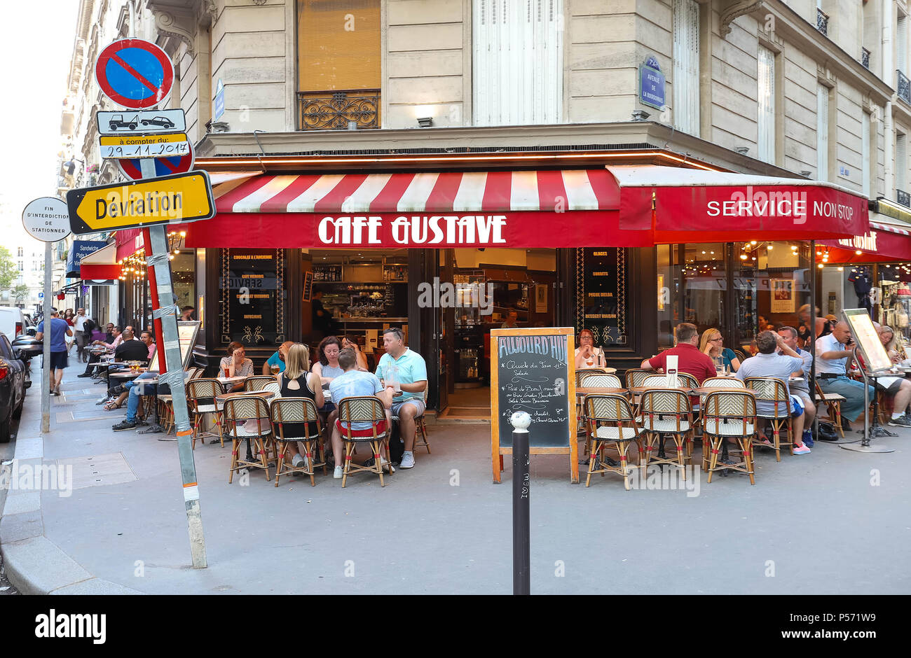 Street cafe with eiffel tower in the background hires stock