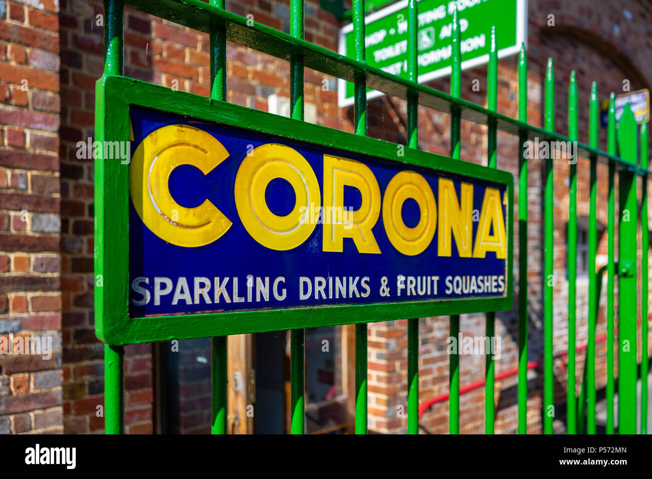 Blue and yellow vintage advertising sign for Corona soft drinks, England, UK Stock Photo