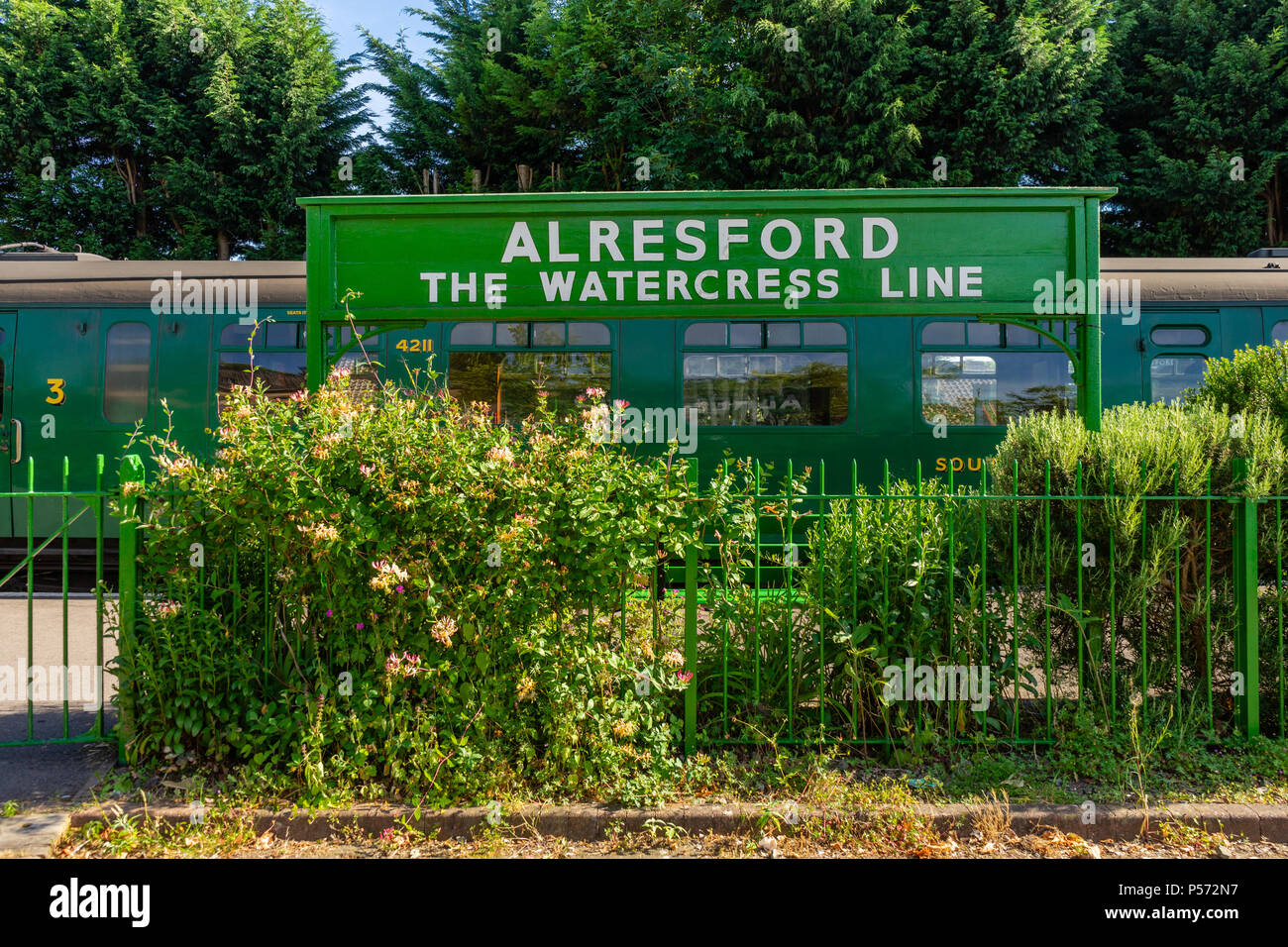 Green vintage sign at Alresfod train station  Watercress Line heritage railway line in Alresford, Hampshire, England, UK Stock Photo