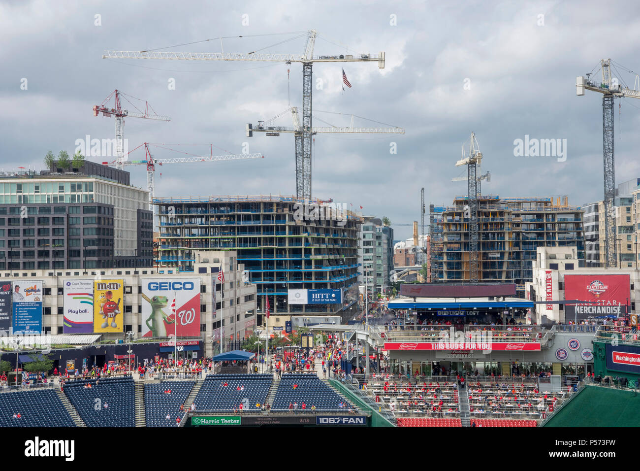 Construction cranes loom over new buildings rising around Nationals Park in Washington, DC. Stock Photo