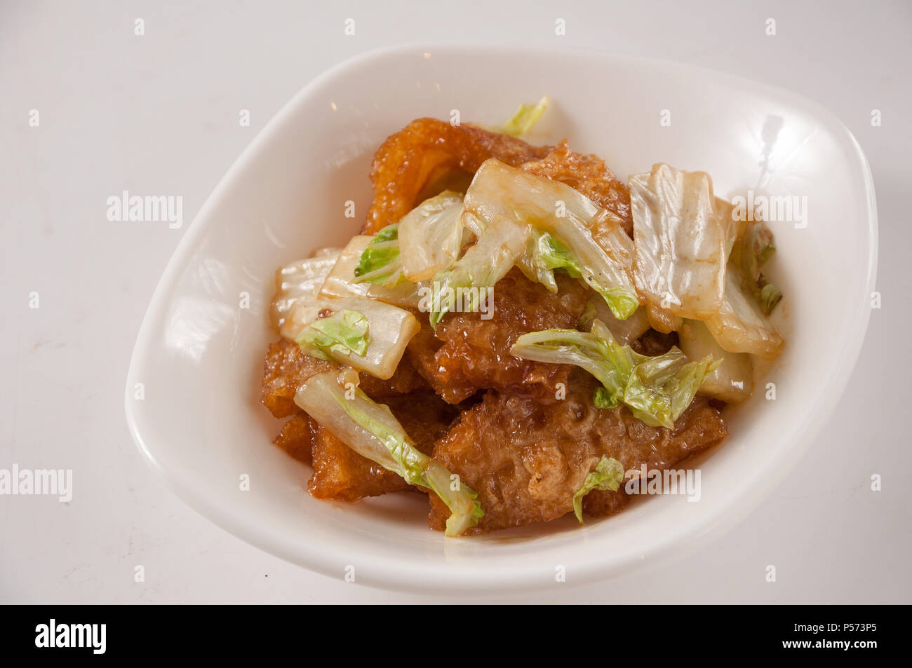 fried pork skin with chinese cabbage Stock Photo
