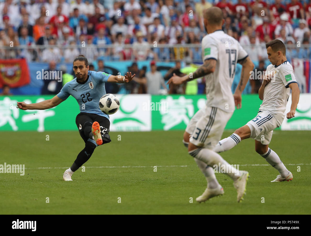 Samara, Russia. 25th June, 2018. Martin Caceres (L) of Uruguay competes during the 2018 FIFA World Cup Group A match between Uruguay and Russia in Samara, Russia, June 25, 2018. Credit: Bai Xueqi/Xinhua/Alamy Live News Stock Photo