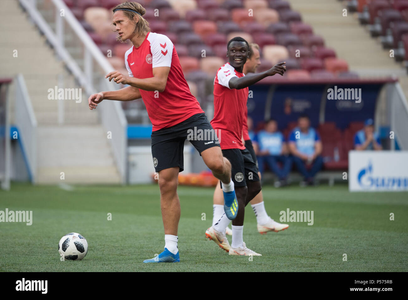 Moscow, Russia. 25th June, 2018. Soccer: FIFA World Cup 2018: Denmark's Jannik Vestergaard (L) and Pione Sisto in action during the training session at the Luzhniki Stadium. Credit: Federico Gambarini/dpa/Alamy Live News Stock Photo