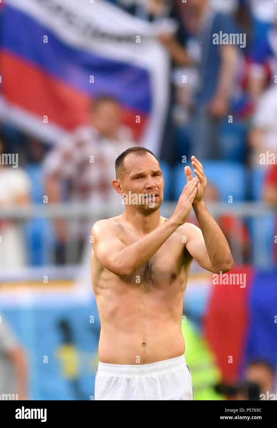 Samara, Russia. 25th June, 2018. Soccer: World Cup, group stages, group A, 3rd matchday Uruguay vs Russia, at Samara Stadium. Russia's Sergei Ignashevich reacts after the match. Credit: Marius Becker/dpa/Alamy Live News Stock Photo
