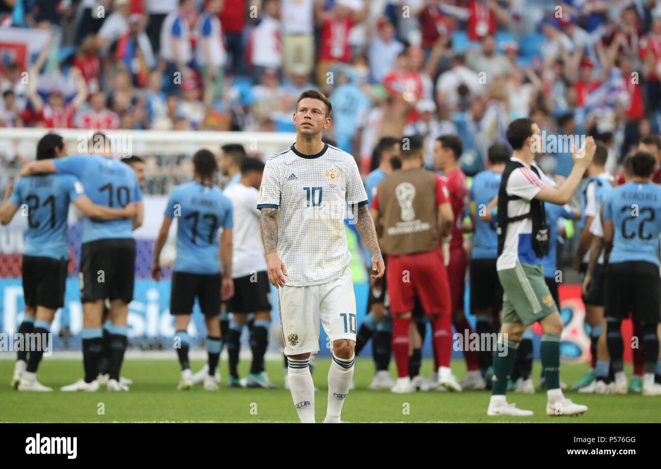 Samara, Russia. 25th June, 2018. Fedor Smolov (front) of Russia reacts after the 2018 FIFA World Cup Group A match between Uruguay and Russia in Samara, Russia, June 25, 2018. Uruguay won 3-0. Russia and Uruguay advanced to the round of 16. Credit: Bai Xueqi/Xinhua/Alamy Live News Stock Photo
