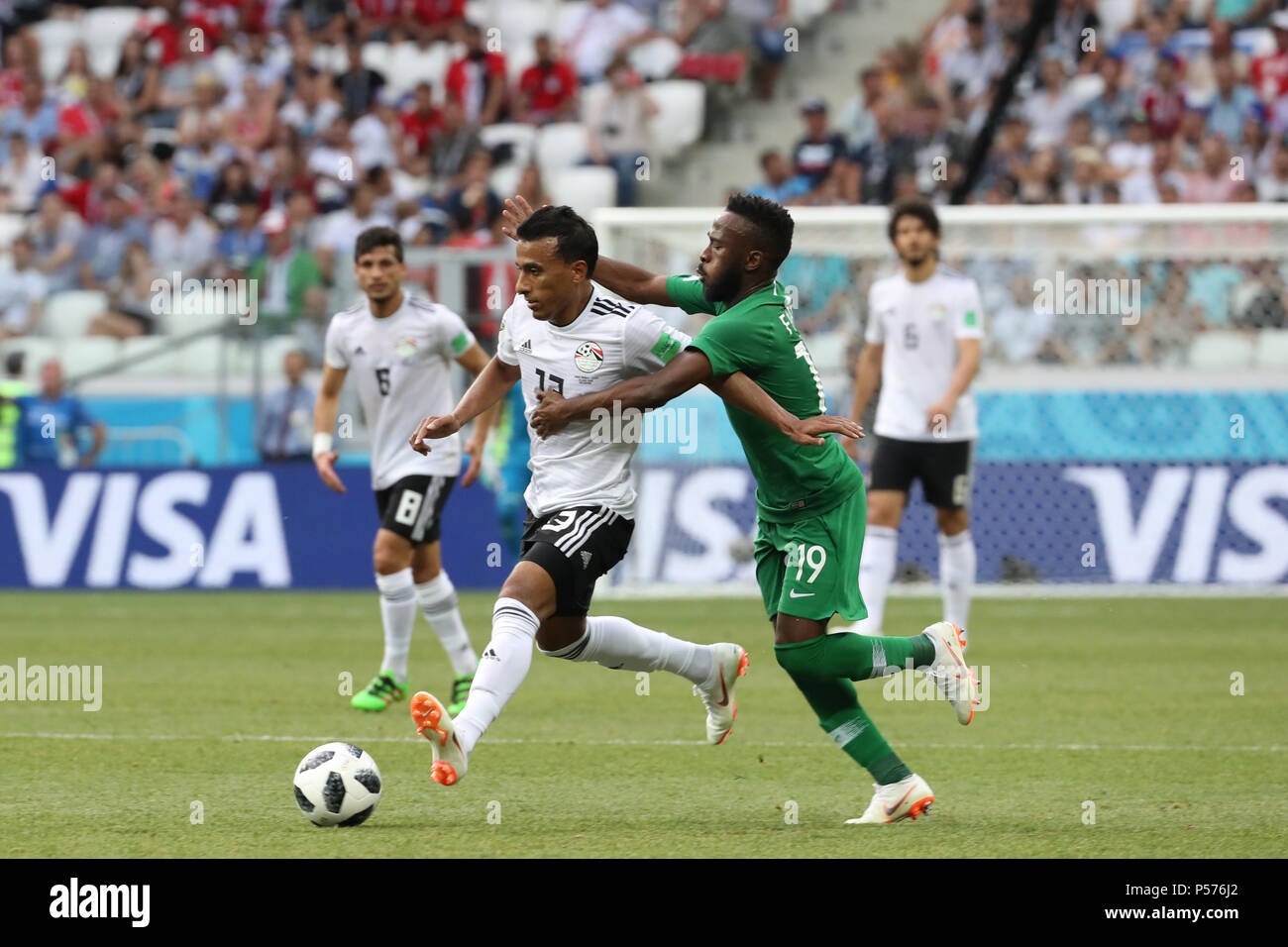 Volgograd, Russia. 25th June, 2018. Egypt's Mohamed Abdel-Shafy (L) battles for the ball with Saudi Arabia's Fahad Al-Muwallad during the FIFA World Cup 2018 Group A soccer match between Saudi Arabia and Egypt at the Volgograd Arena in Volgograd, Russia, 25 June 2018. Credit: Ahmed Ramadan/dpa/Alamy Live News Stock Photo