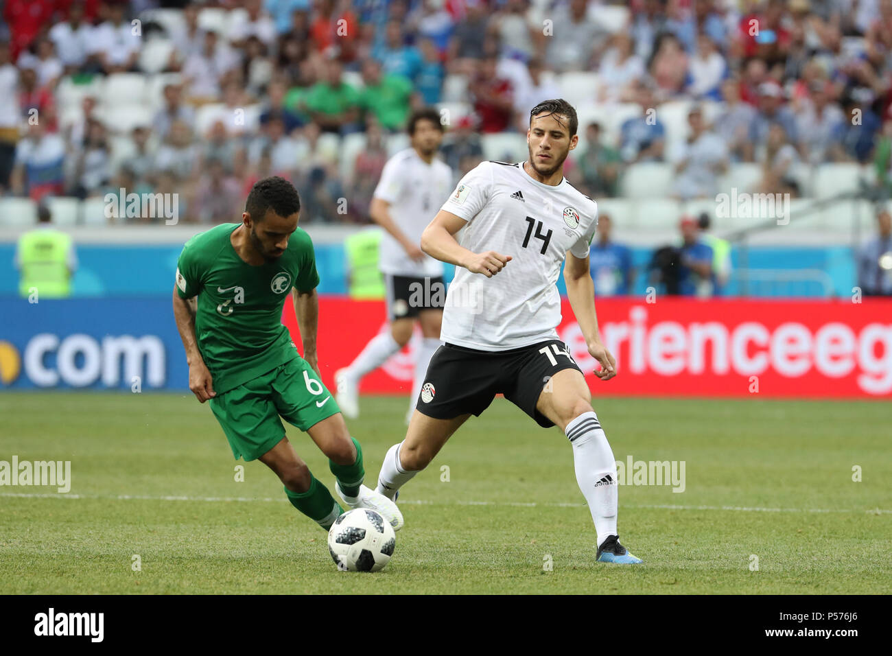 Volgograd, Russia. 25th June, 2018. Egypt's Ramadan Sobhi (R) battles for the ball with Saudi Arabia's Mohammed Al-Breik during the FIFA World Cup 2018 Group A soccer match between Saudi Arabia and Egypt at the Volgograd Arena in Volgograd, Russia, 25 June 2018. Credit: Ahmed Ramadan/dpa/Alamy Live News Stock Photo