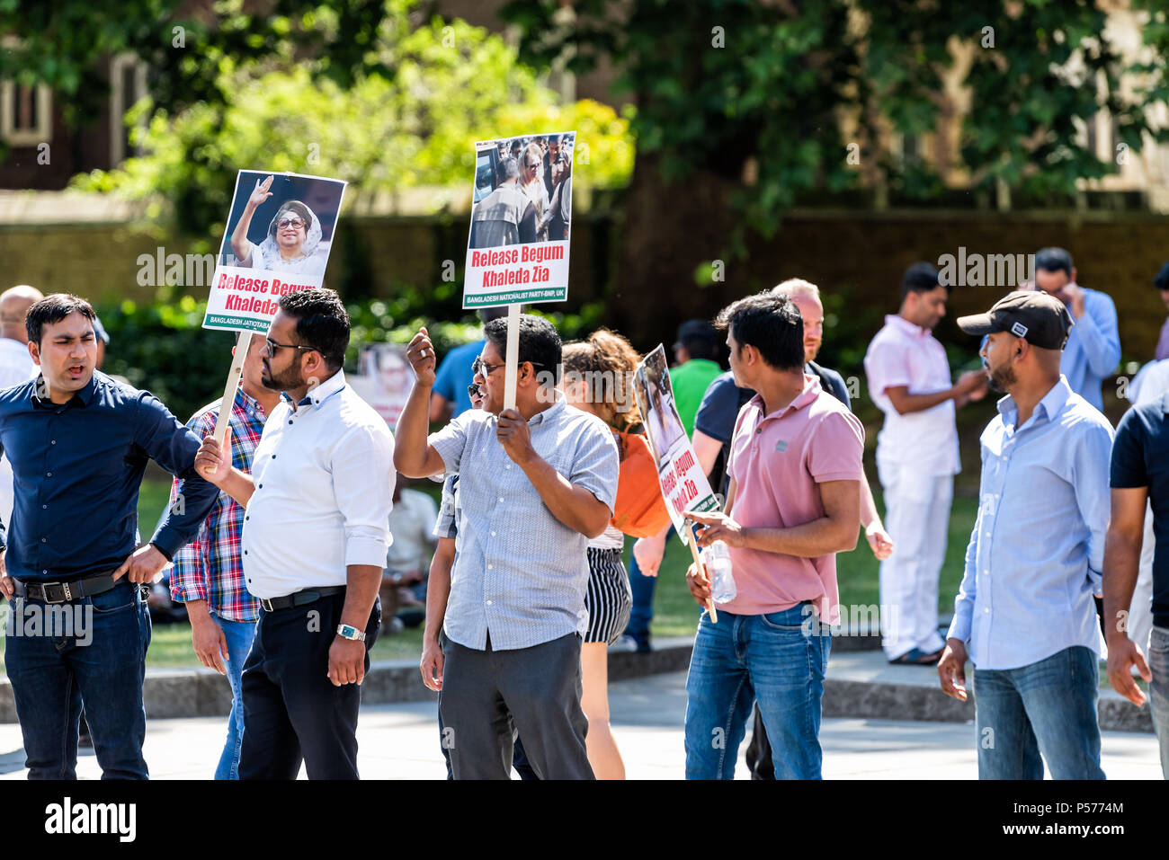 London, United Kingdom - June 25, 2018: People, men closeup at Bangladesh protest in UK England by Westminster with signs for Begum Khaleda Zia, former Nationalist Party leader Credit: Kristina Blokhin/Alamy Live News Stock Photo