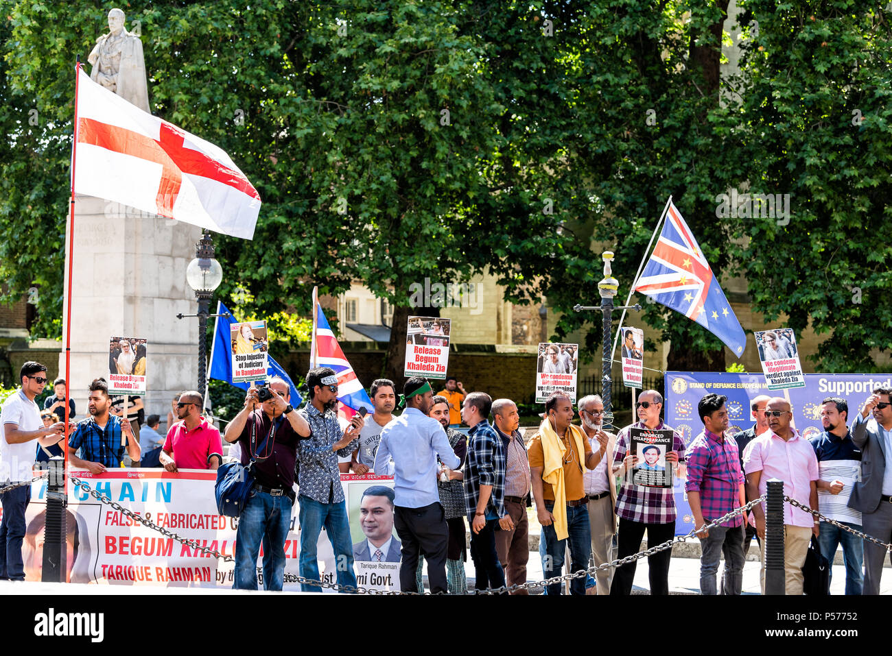 London, United Kingdom - June 25, 2018: People standing at Bangladesh and anti Brexit protest in UK England by Westminster with flags, signs for releasing Begum Khaleda Zia Credit: Kristina Blokhin/Alamy Live News Stock Photo