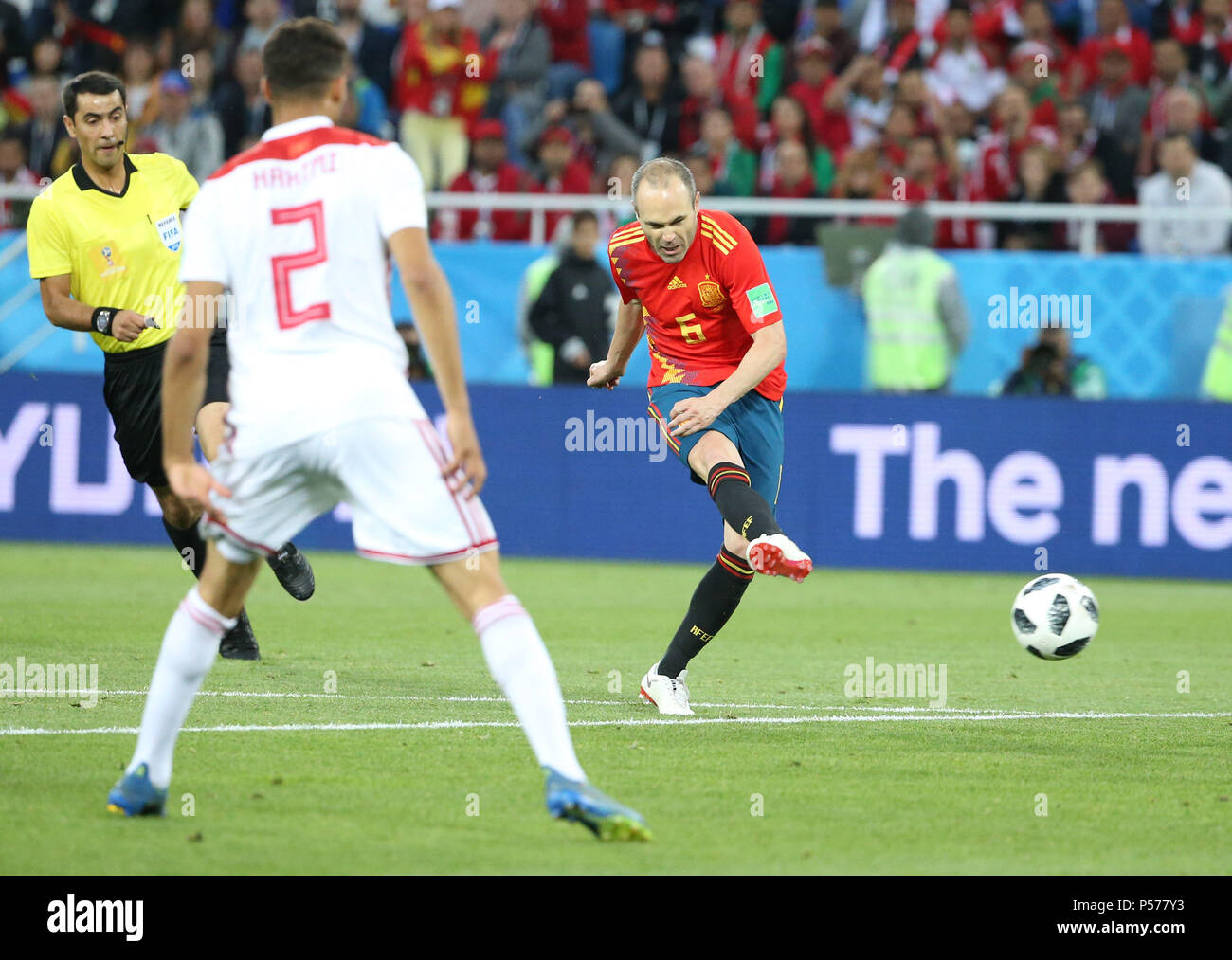 Kaliningrad, Russia. 25th June, 2018. Andres Iniesta (R) of Spain shoots during the 2018 FIFA World Cup Group B match between Spain and Morocco in Kaliningrad, Russia, June 25, 2018. Credit: Li Ming/Xinhua/Alamy Live News Stock Photo