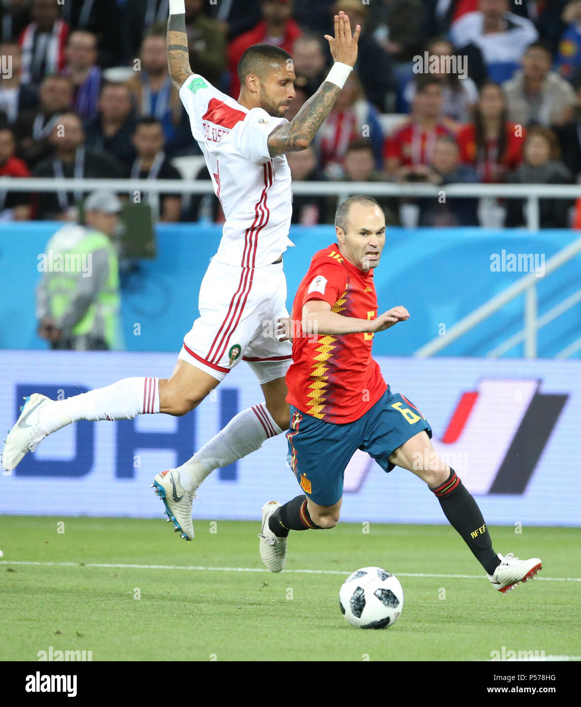 Kaliningrad, Russia. 25th June, 2018. Andres Iniesta (R) of Spain breaks through with the ball during the 2018 FIFA World Cup Group B match between Spain and Morocco in Kaliningrad, Russia, June 25, 2018. Credit: Li Ming/Xinhua/Alamy Live News Stock Photo