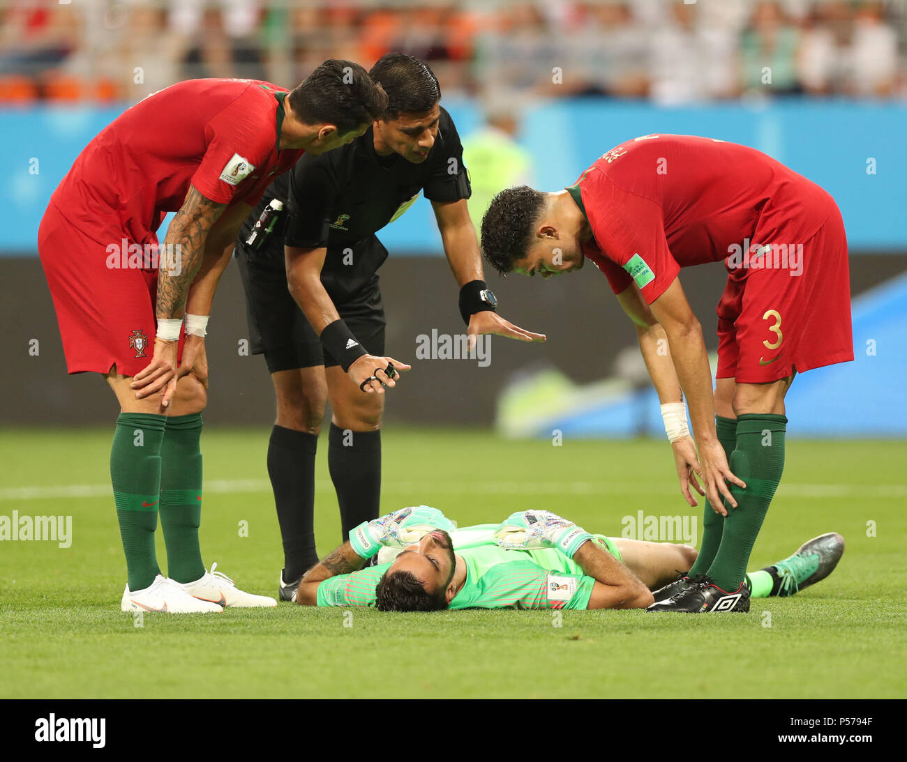 Saransk, Russia. 25th June, 2018. The referee talks to Portugal's goalkeeper Rui Patricio (bottom) during the 2018 FIFA World Cup Group B match between Iran and Portugal in Saransk, Russia, June 25, 2018. Credit: Fei Maohua/Xinhua/Alamy Live News Stock Photo