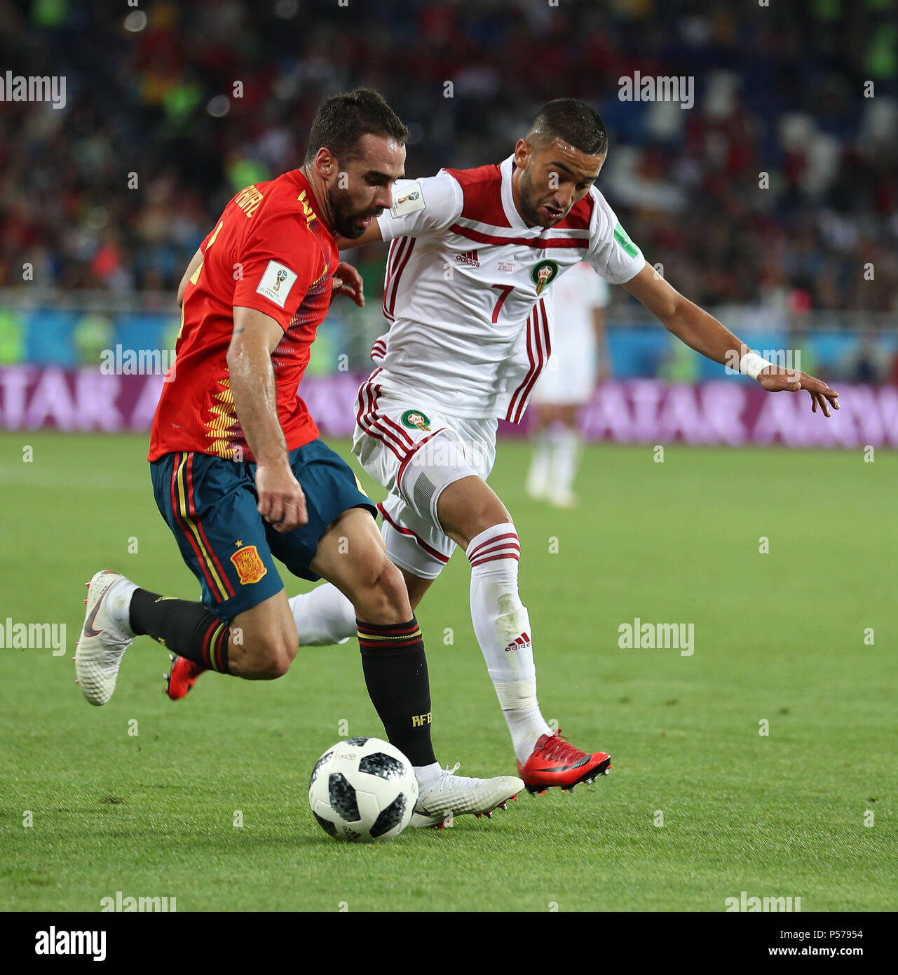 Kaliningrad, Russia. 25th June, 2018. Dani Carvajal (L) of Spain vies with Hakim Ziyach of Morocco during the 2018 FIFA World Cup Group B match between Spain and Morocco in Kaliningrad, Russia, June 25, 2018. Credit: Lu Jinbo/Xinhua/Alamy Live News Stock Photo