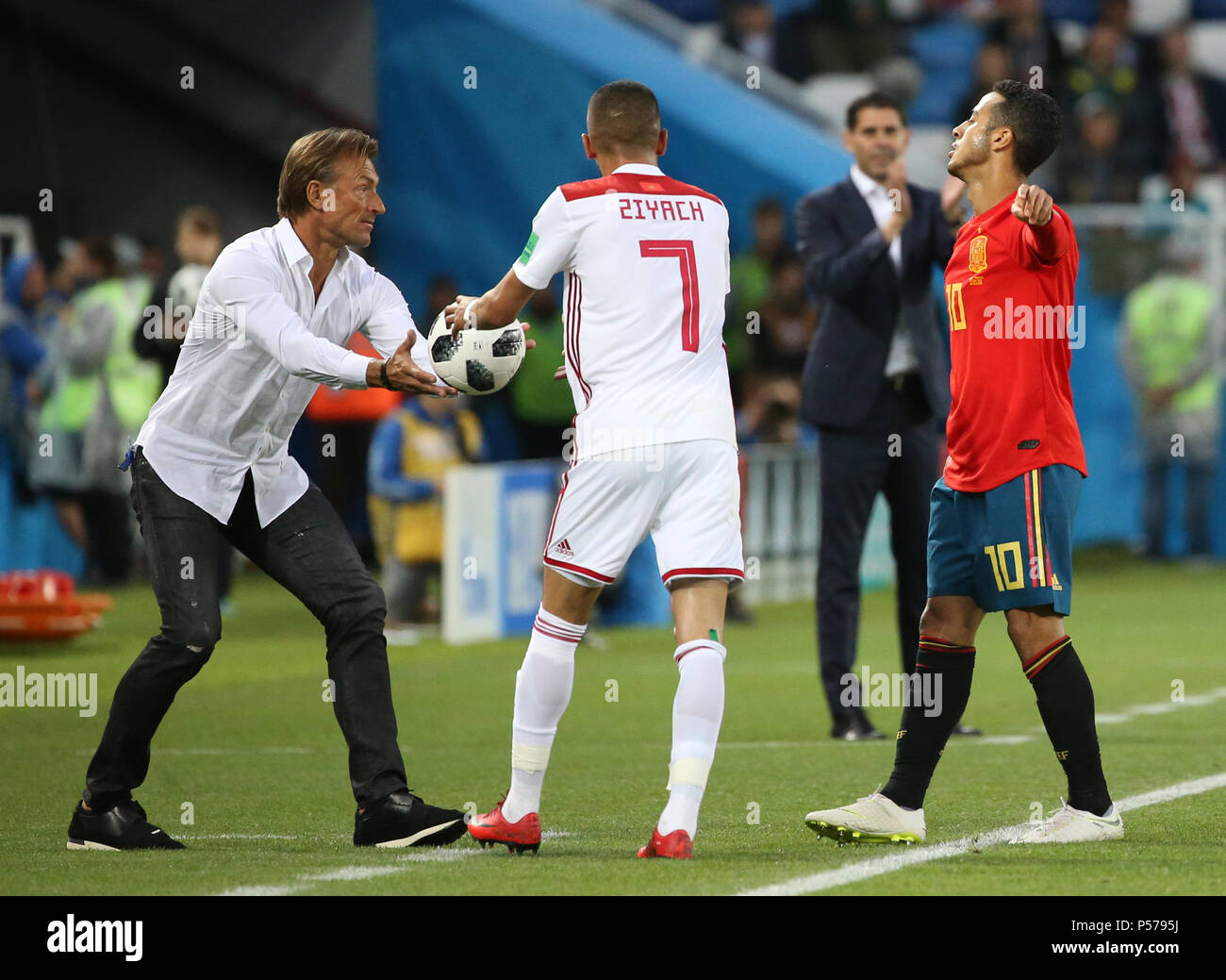 Kaliningrad, Russia. 25th June, 2018. Head coach Herve Renard (L) of Morocco passes the ball to Hakim Ziyach during the 2018 FIFA World Cup Group B match between Spain and Morocco in Kaliningrad, Russia, June 25, 2018. Credit: Li Ming/Xinhua/Alamy Live News Stock Photo