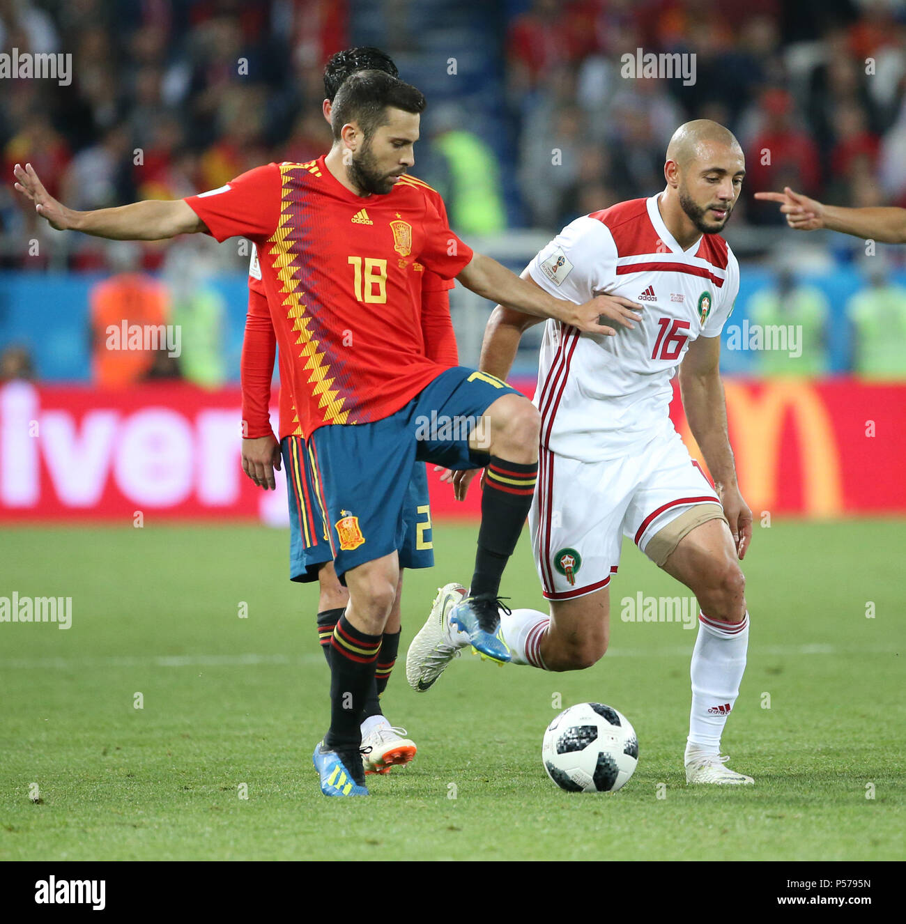 Kaliningrad, Russia. 25th June, 2018. Noureddine Amrabat (R) of Morocco  vies with Jordi Alba of Spain during the 2018 FIFA World Cup Group B match  between Spain and Morocco in Kaliningrad, Russia,