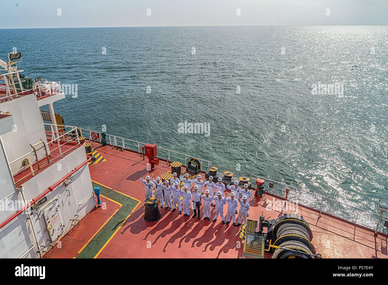 Quanzhou. 21st June, 2018. Seafarers pose for photo on the freighter 'Jinhaifa', June 21, 2018. The freighter 'Jinhaifa' ships bulk coal between harbours in north China and Quanzhou in southeast China's Fujian Province. Seafarers on the freighter usually spend 6 to 8 months working and living on the sea then have two to four months' rest. June 25 marked the Day of the Seafarer. There had been 1.483 million registered seafarers in China by the end of 2017. Credit: Cai Yang/Xinhua/Alamy Live News Stock Photo