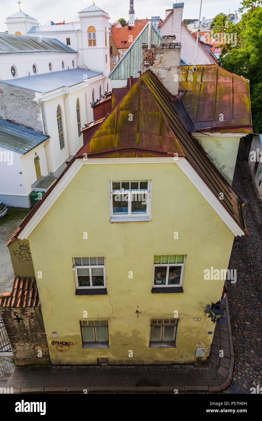 Top view of old architectural yellow with white trim and rusted