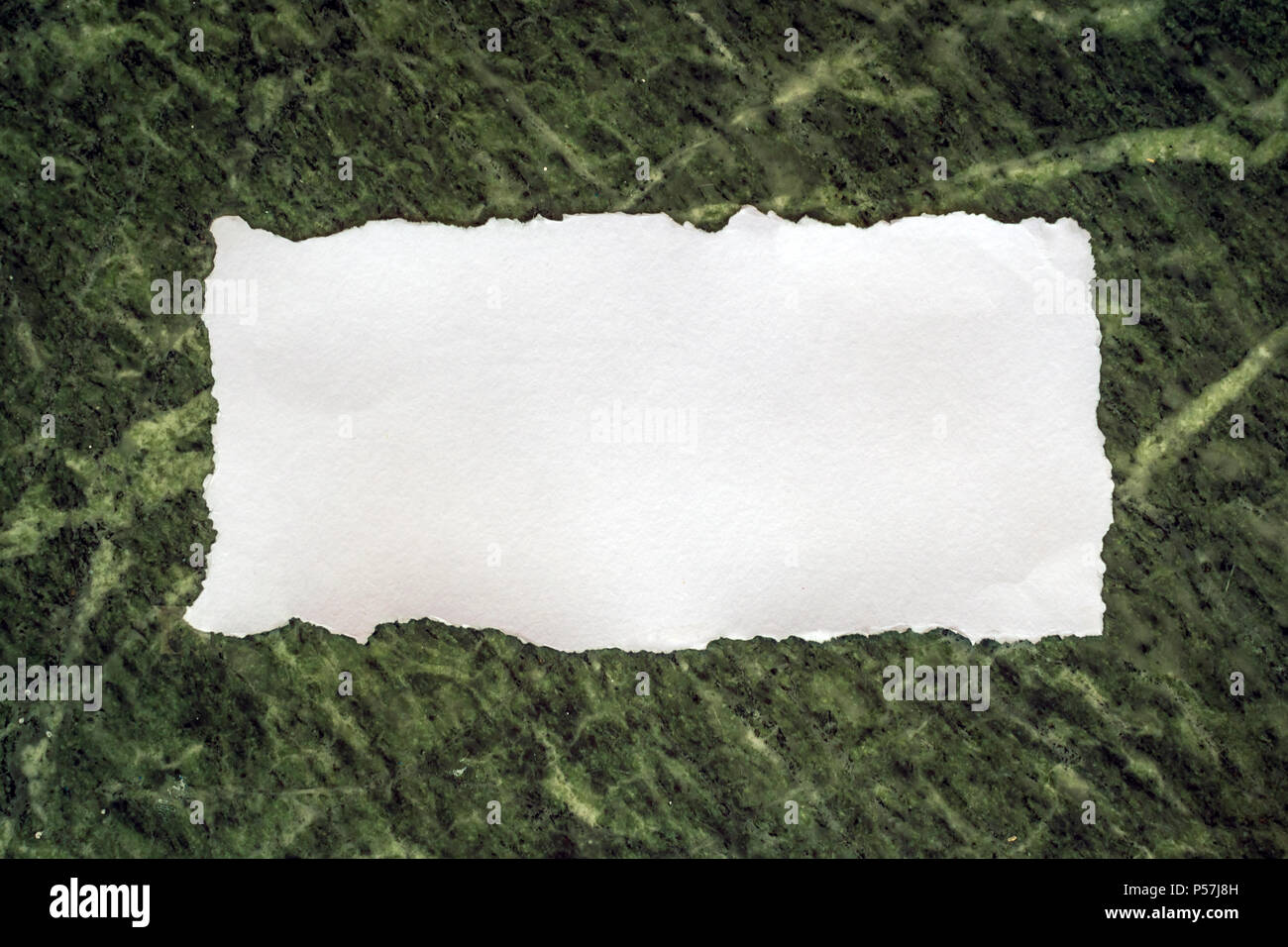 White sheet of paper on a marble background for love notes and invitation cards Stock Photo