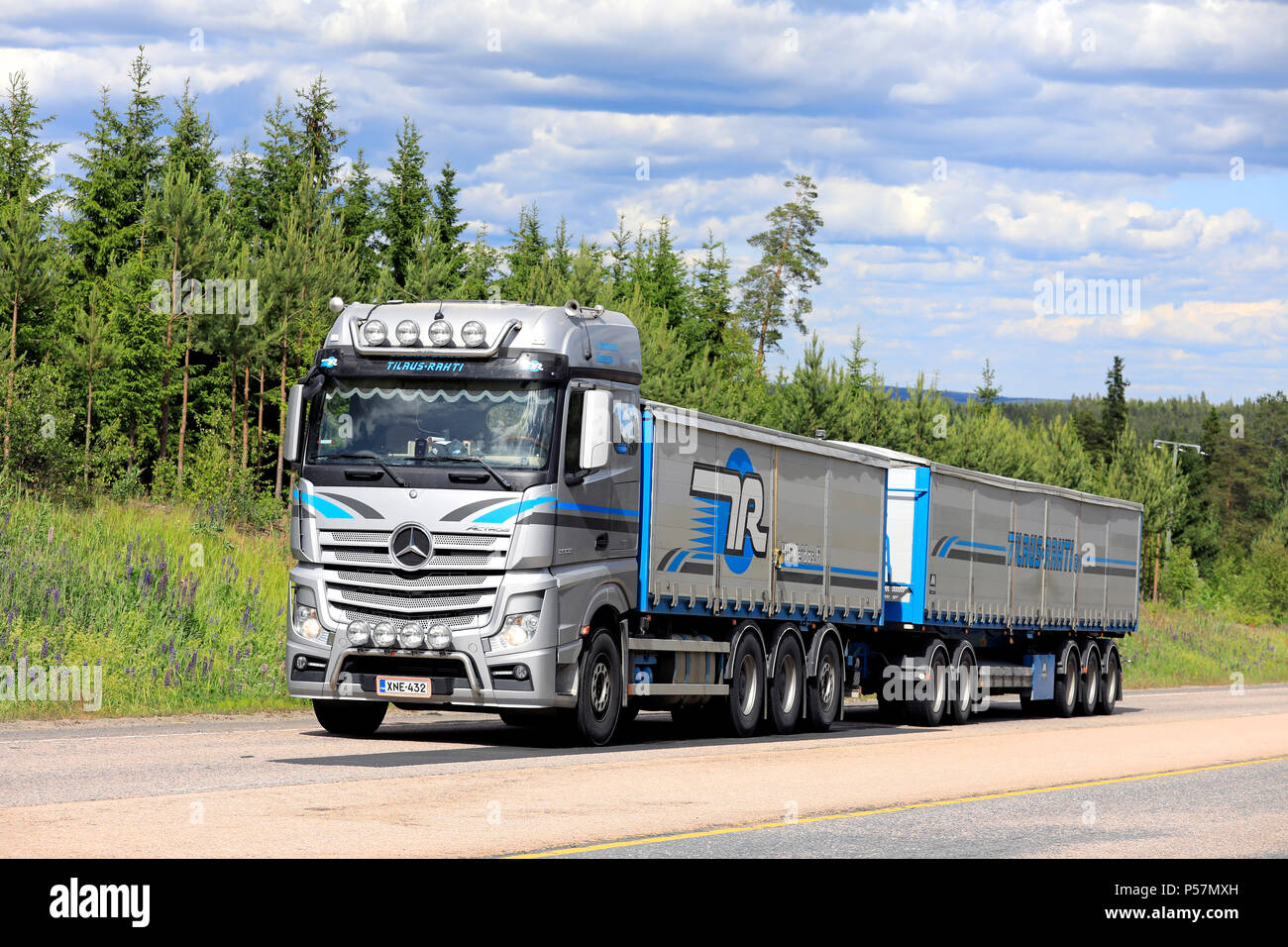 Beautifully customized Mercedes-Benz Actros general cargo transporter of Tilaus-Rahti Oy on highway on a day of summer. Jamsa, Finland - June 14,2018. Stock Photo