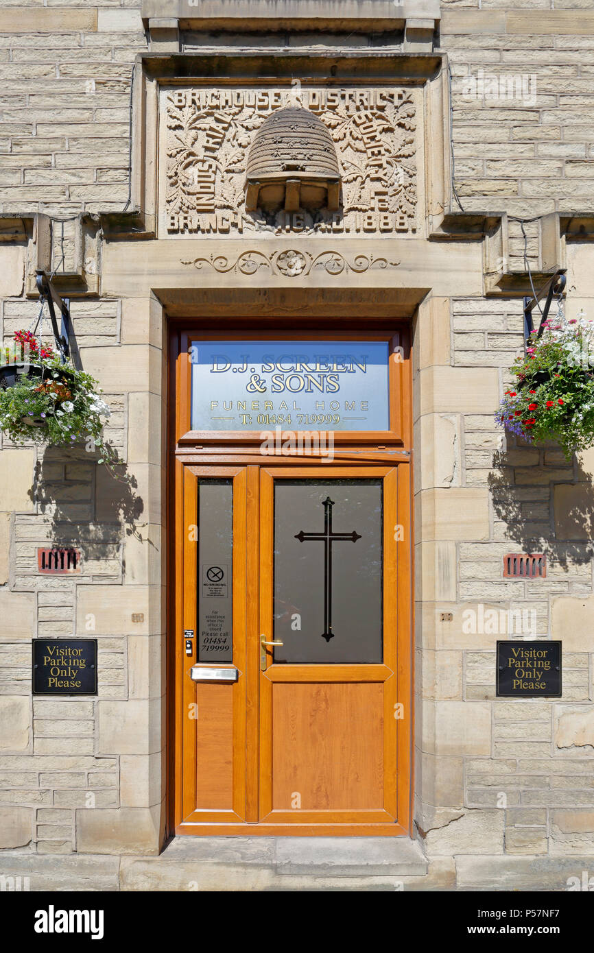 Former Brighouse District Industrial Society Ltd, Branch No 16, AD 1888 with carved Co-op beehive above doorway, Brighouse, West Yorkshire, England. Stock Photo