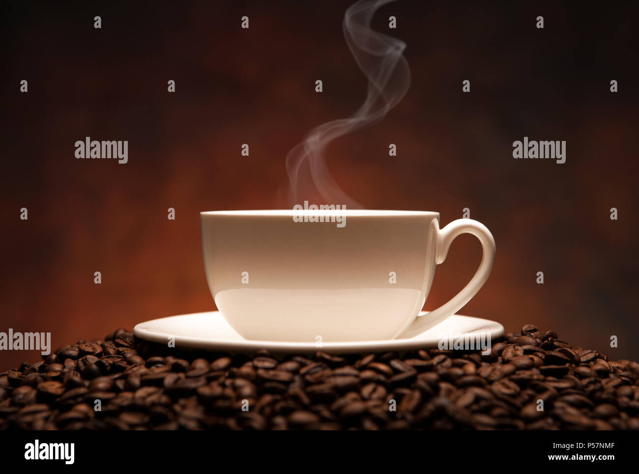 cup of coffee with smoke on a coffee background Stock Photo - Alamy
