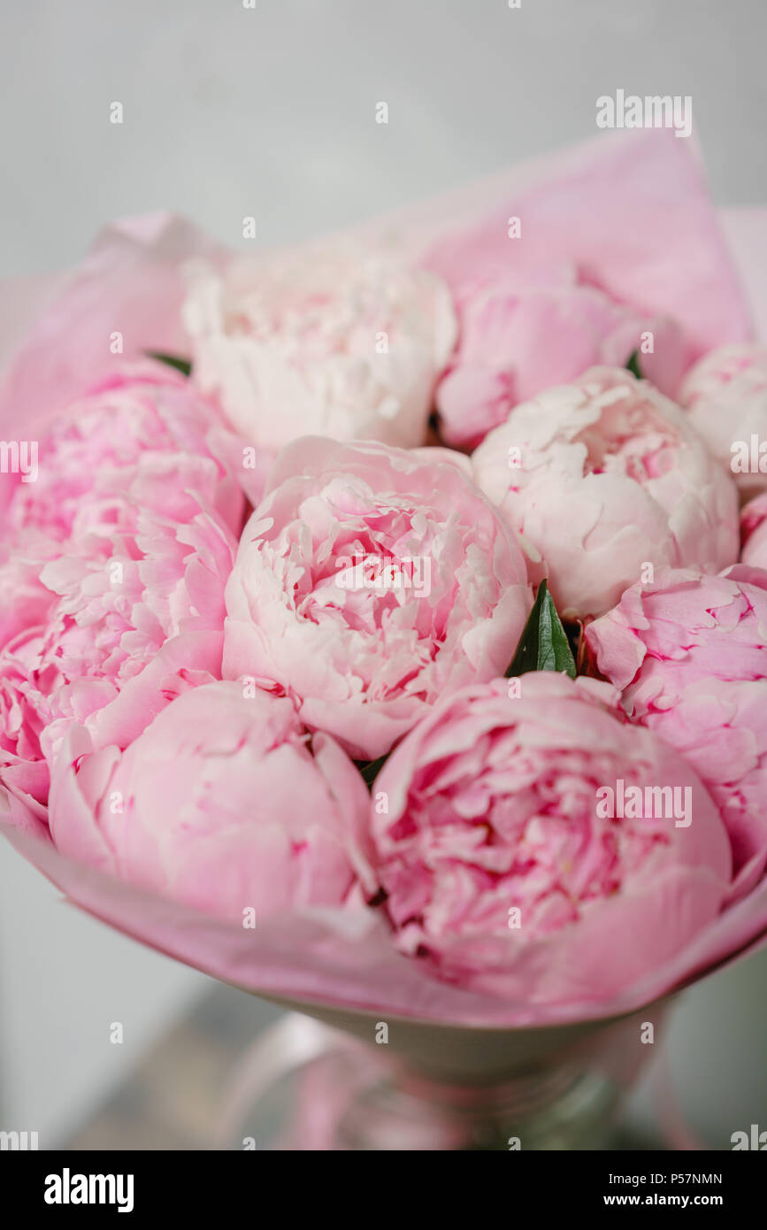 Lovely flowers in glass vase. Beautiful bouquet of pink peonies ...