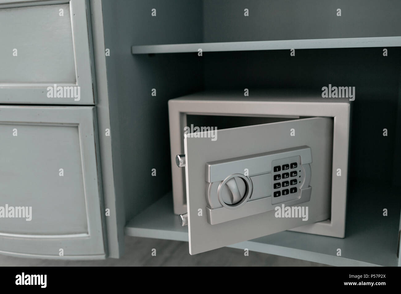 Open safe in a wealthy house. Safety box in hotel room. Concept safe