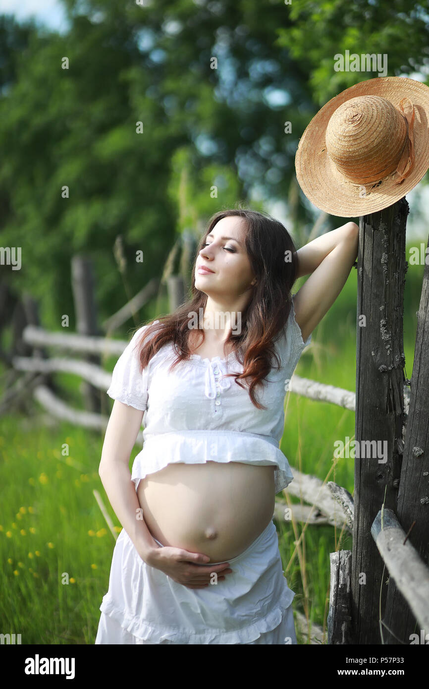 Pregnant woman in nature for a walk in the early summer Stock Photo - Alamy