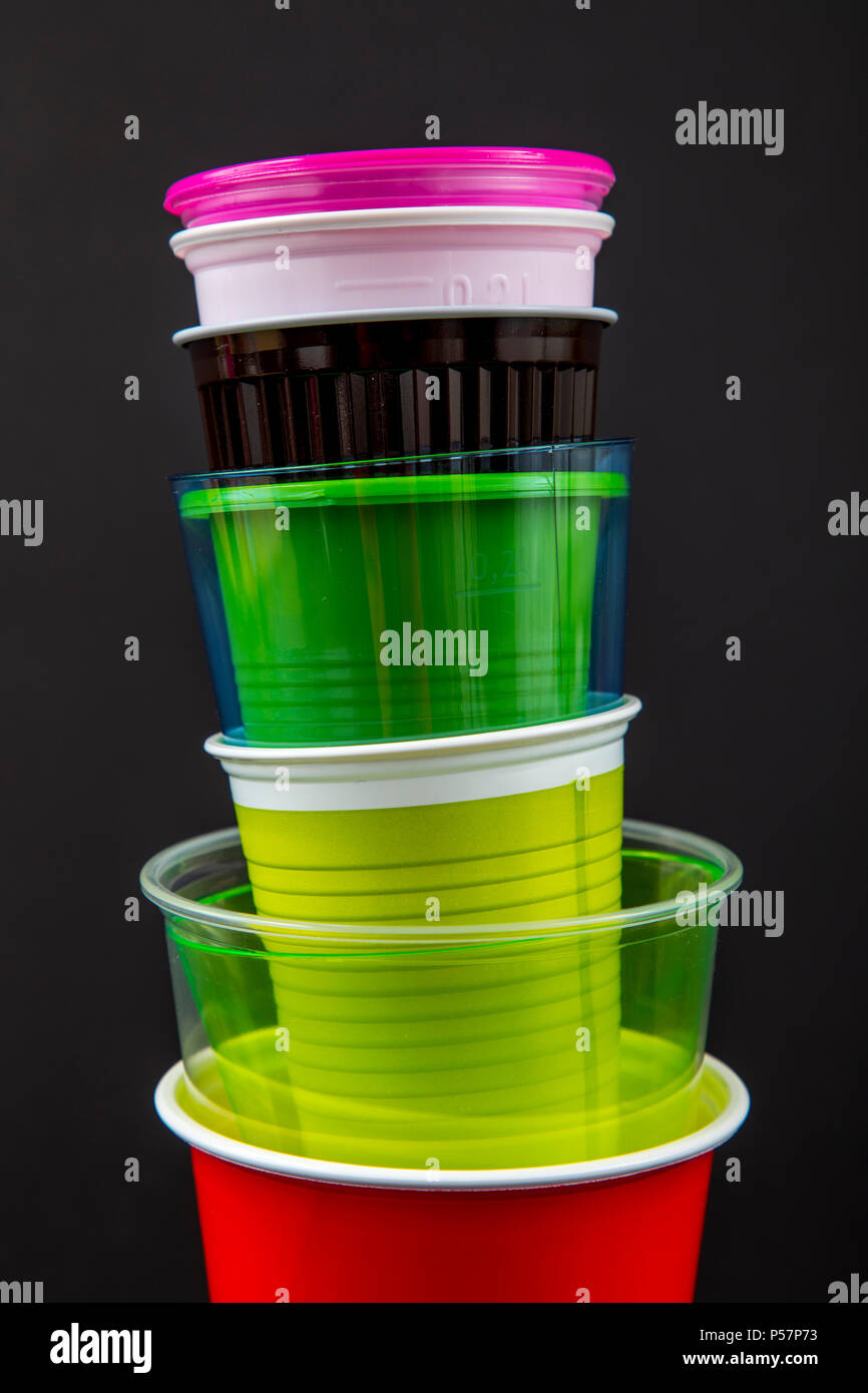 Plastic cups, many different types, shapes, colors, disposable cups, plastic waste Stock Photo